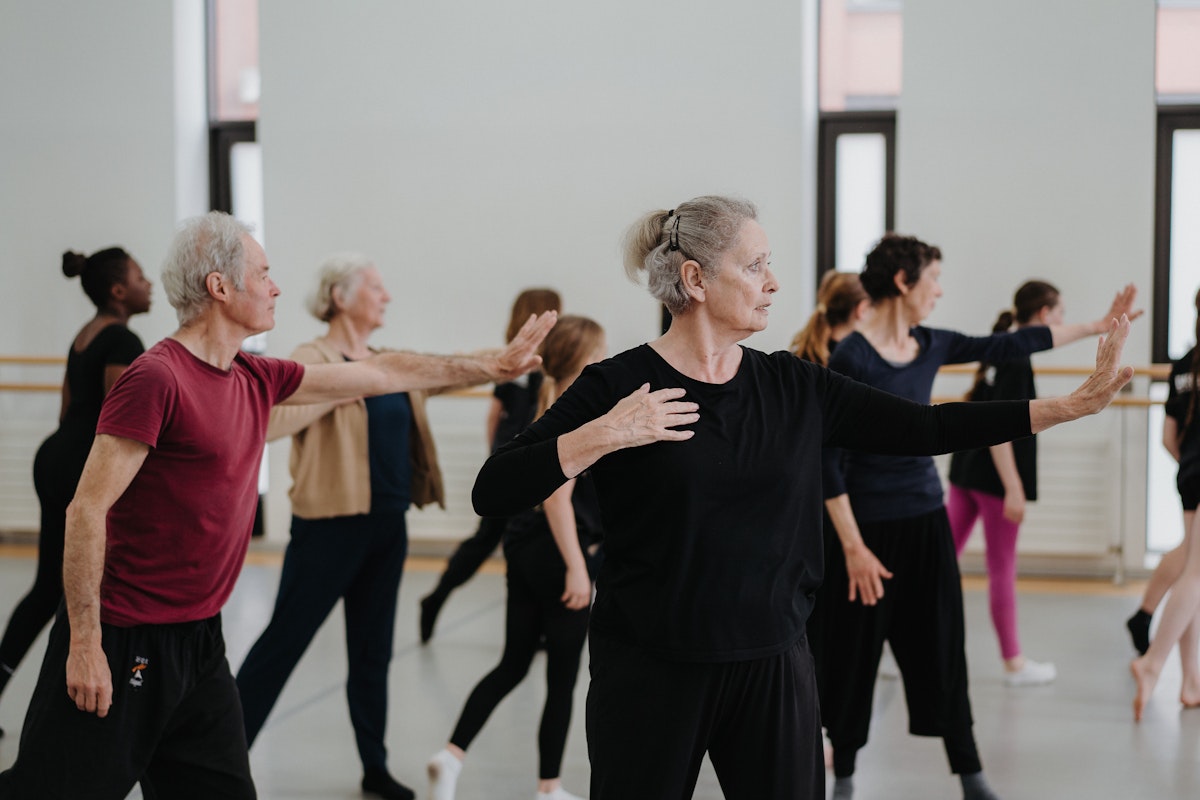 Dancers spanning seven decades moving together